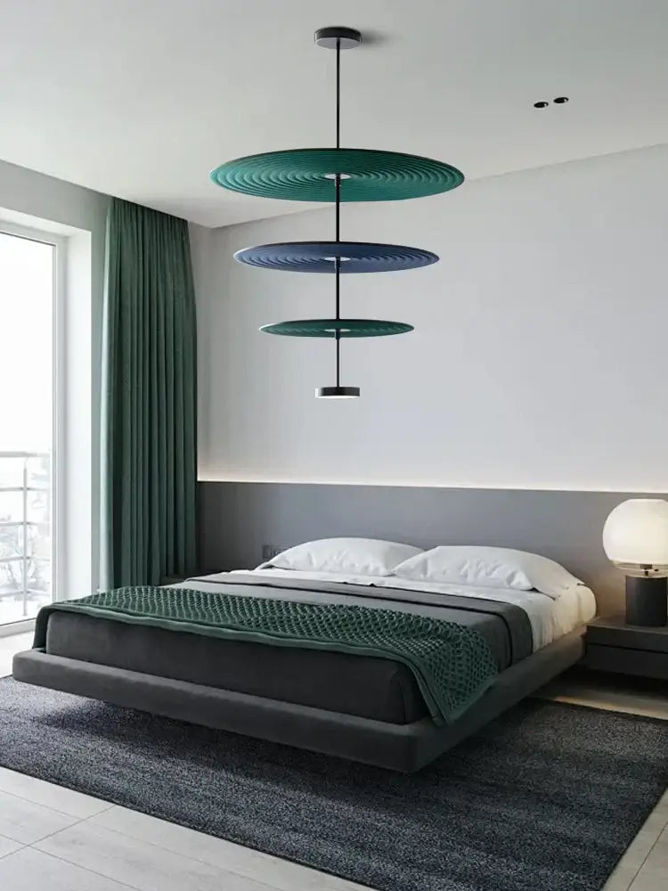 Modern tiered cotton round led pendant lights with teal and navy blue concentric rings suspended by a black rod decorbites cotton round