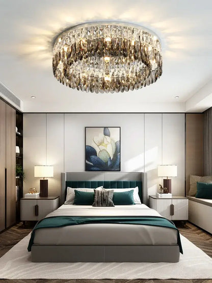 Modern tiered decorbites crystal chrome ceiling lamp with circular faceted crystals emitting a warm glow for living room