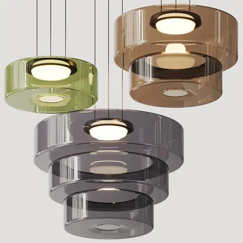 Modern tiered pendant light with translucent green amber and gray glass featuring circular illuminated centers by decorbites bohemia glass