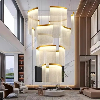 A modern tiered gold led ceiling chandelier with cascading translucent panels for elegant dining room lighting