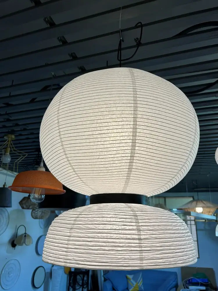 Modern tiered off-white paper pendant lights with vertical ridges and black hanging fixture by decorbites designer led