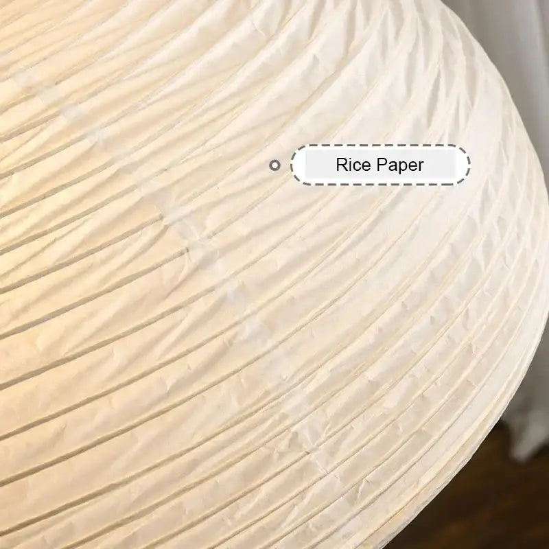 A cream-colored rice paper designer led pendant light with ribbed pleated texture for modern dining room decorbites pendant lights