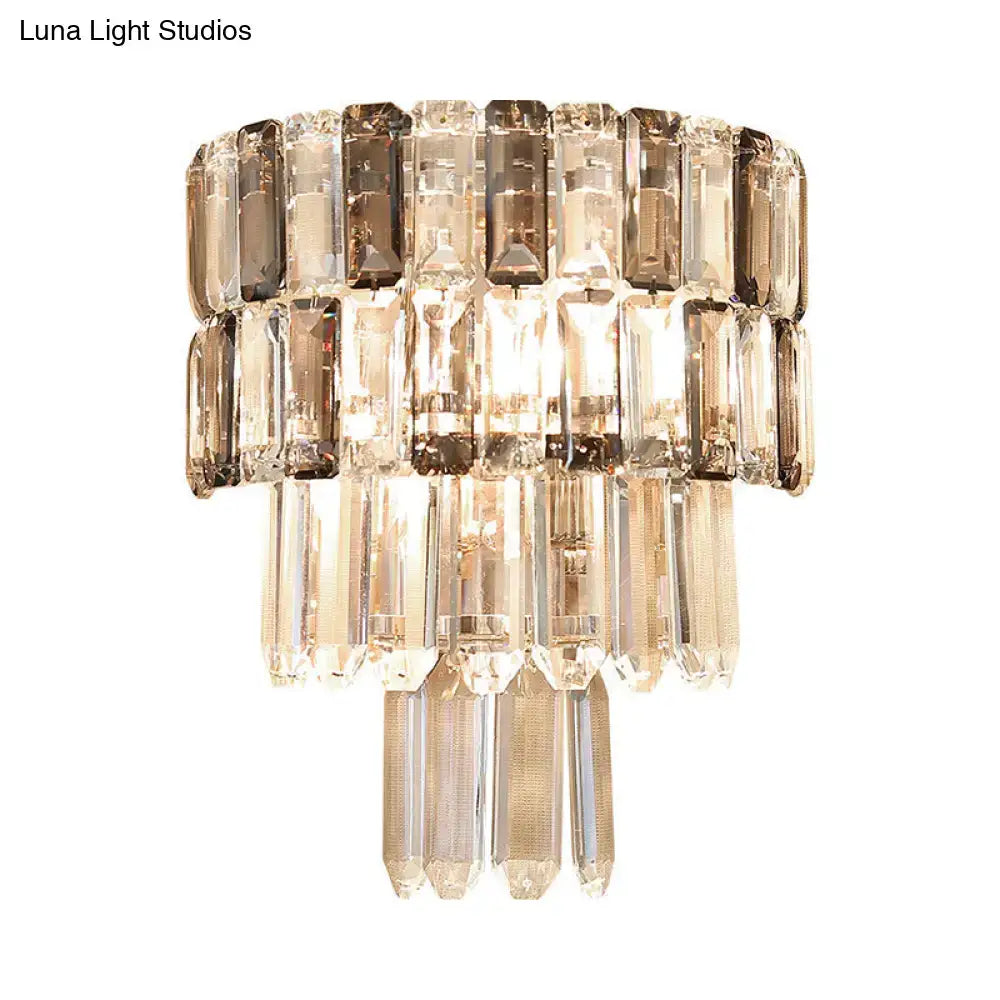 Modern tiered smoke gray crystal wall sconce with faceted smoked and clear glass rods for living room decor