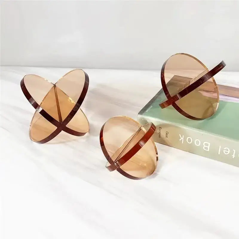 Translucent amber acrylic geometric bookends with dark brown rim accents for modern living room decorbites intersect glass ball semicircle