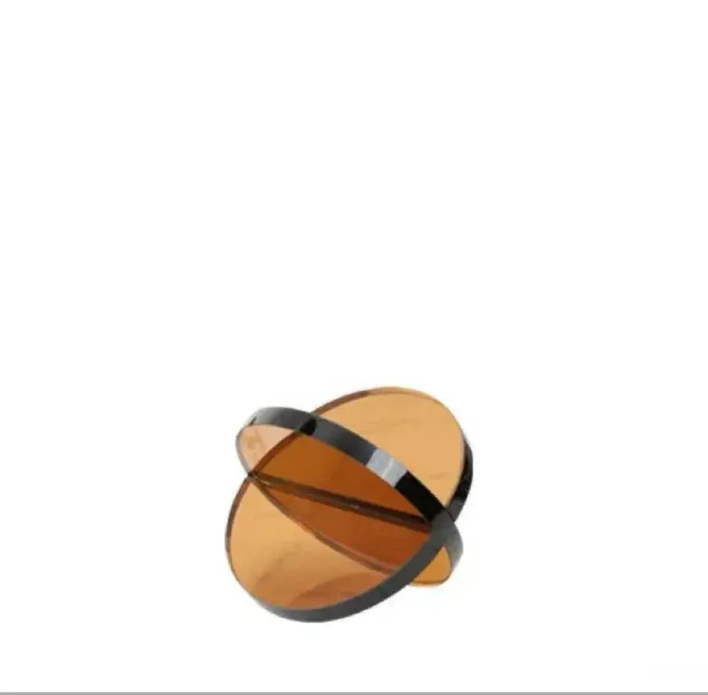 A sleek modern amber intersect glass ball semicircle with black metallic band for living room decorbites decor