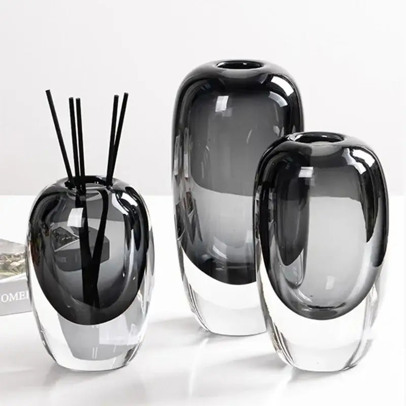 Set of three modern translucent black crystal glass flower vases with a glossy finish for living room decorbites crystal glass decor