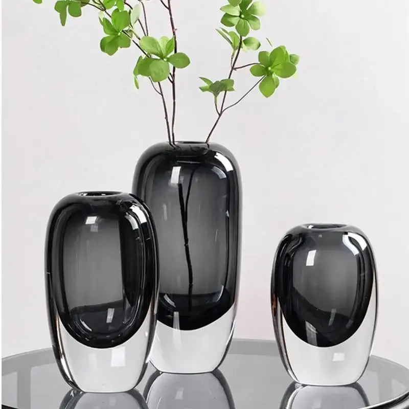 Set of three modern translucent black crystal glass flower vases with sleek glossy decorbites crystal glass design
