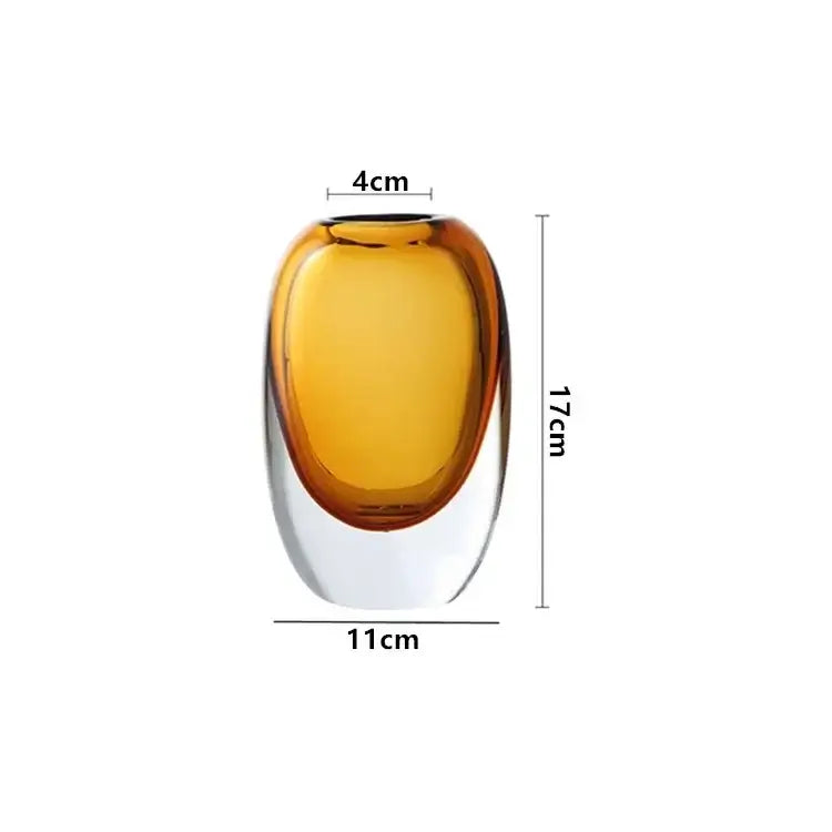 A sleek amber-tinted crystal glass flower vase with a smooth oval body and clear base from decorbites crystal glass set