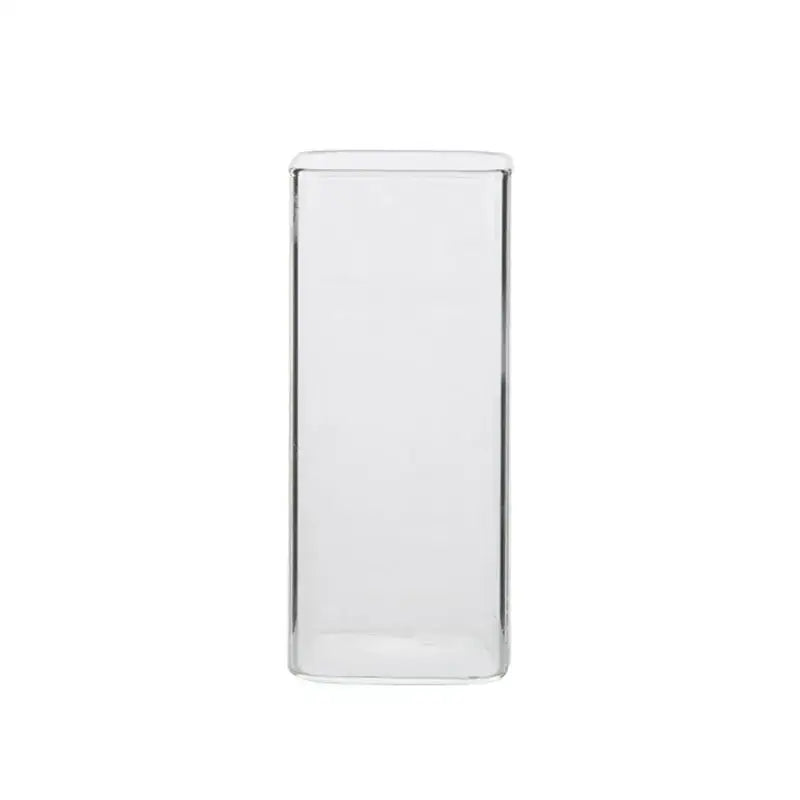 Modern transparent glass square measuring cup with clear smooth sides and a subtle reflective rim for kitchen use