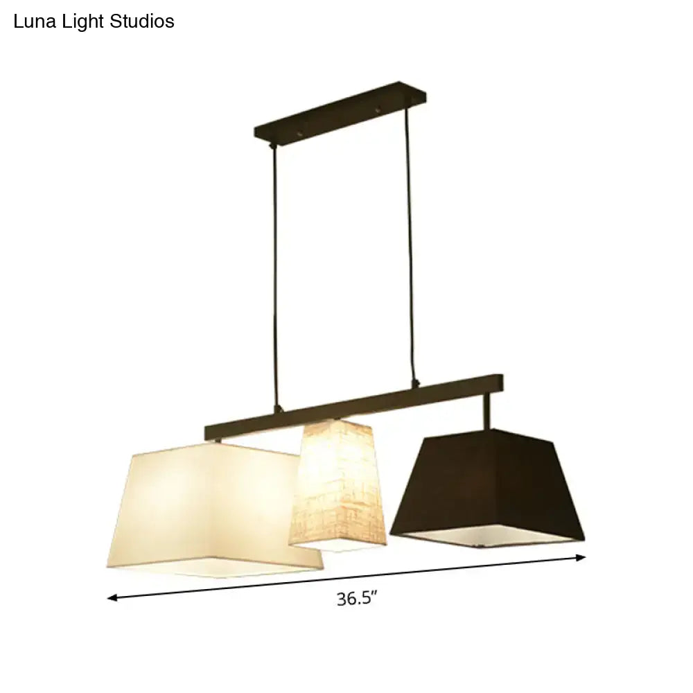 DecorBites™ trapezoid fabric hanging lamp with dark metal frame and cream beige black shades for island light use