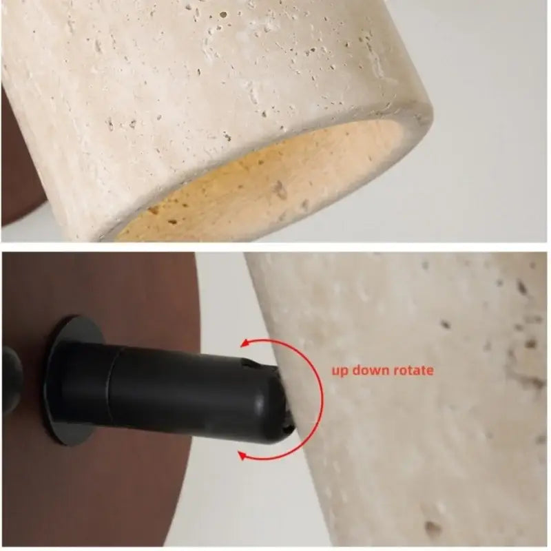 Beige textured concrete cylindrical wall light fixture with black adjustable mounting base and pull chain switch for bedroom