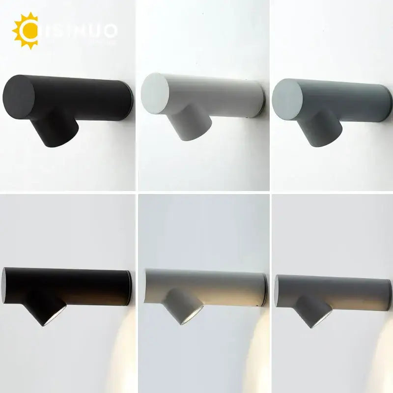 Modern tree branch black and white led wall sconce with a matte black cylindrical body and sleek angular design decorbites led wall