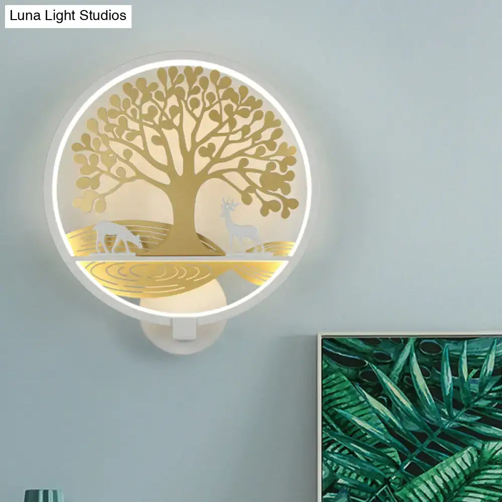 Modern wall lamp featuring a circular golden tree of life design with deer silhouettes and soft white led glow