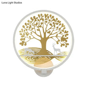 Modern wall lamp with a golden tree of life and deer design on a softly glowing white background for bedroom use