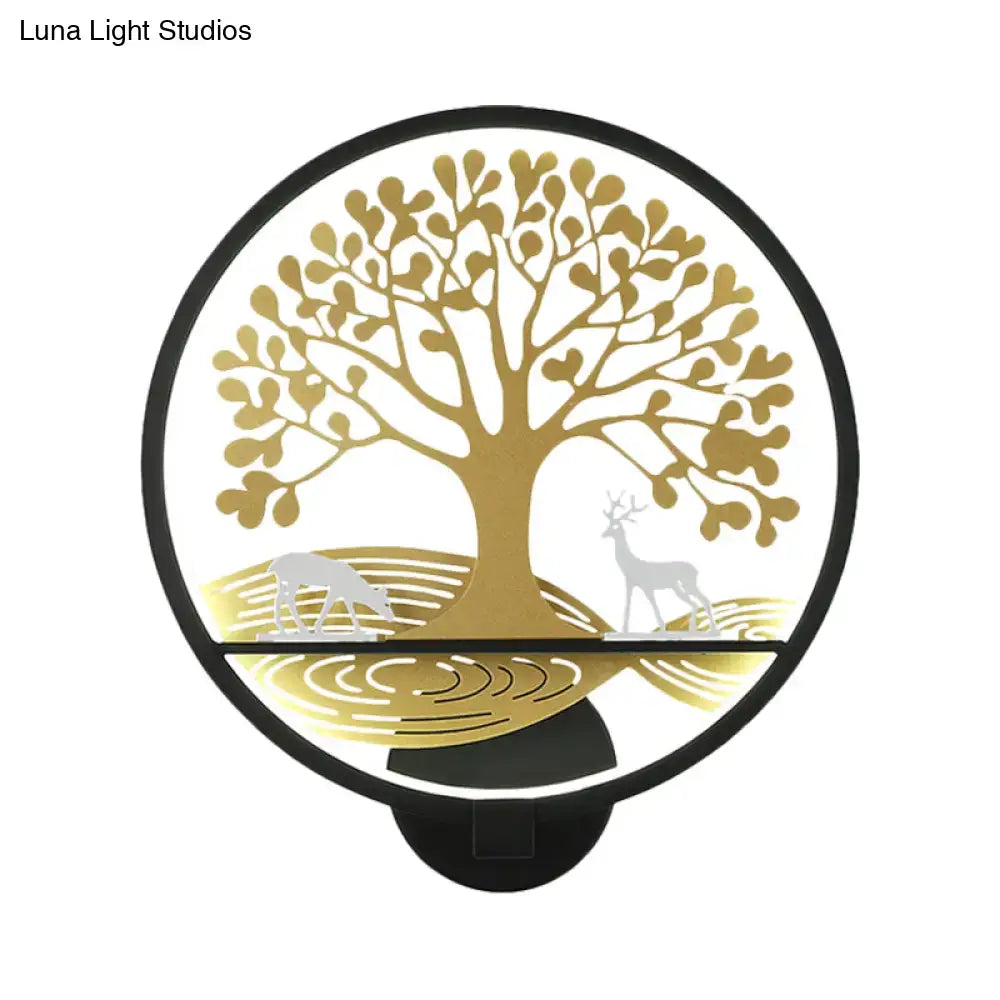 Modern wall lamp featuring a gold tree of life design with deer silhouettes in black trim for bedroom mural lighting
