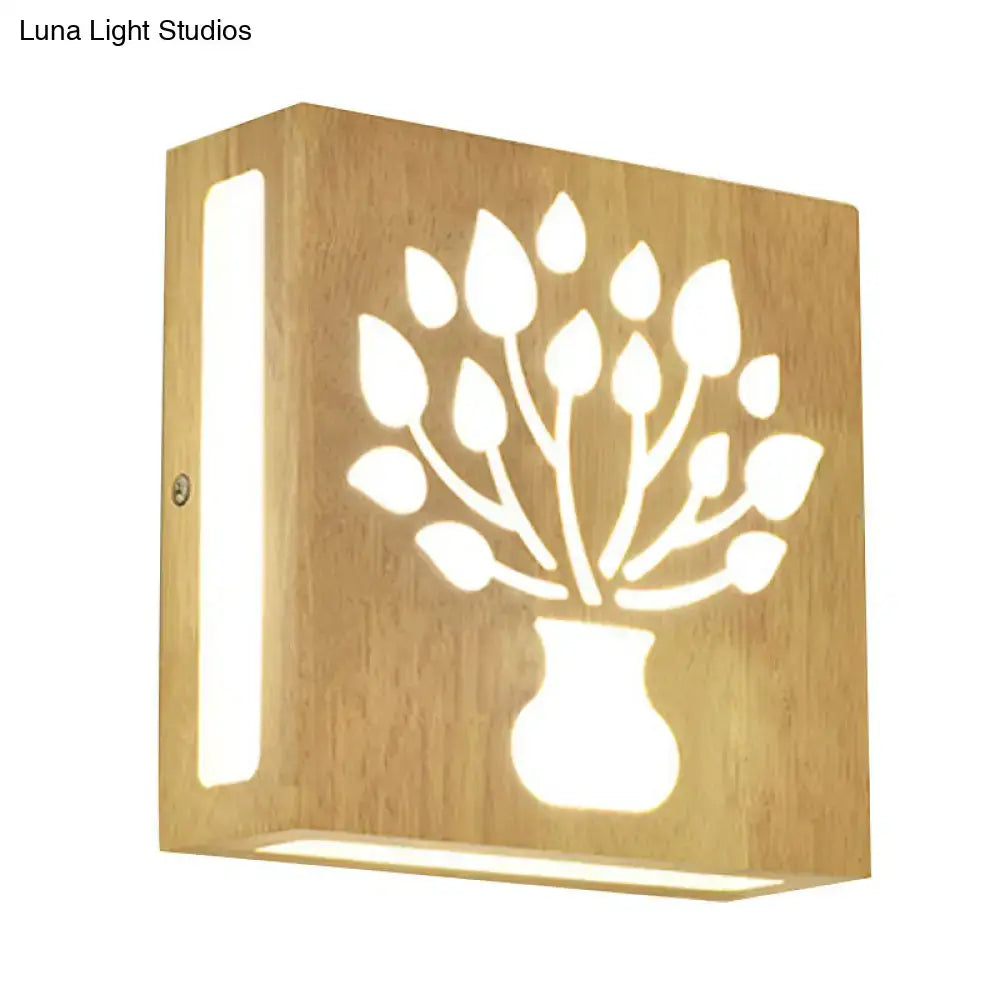Modern tree pattern bamboo wall light with carved design emits warm light direct wired electric maximum bulb wattage compatible