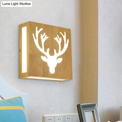 A square wooden wall light featuring a white glowing deer head cutout, made of bamboo, direct wired electric with max bulb wattage
