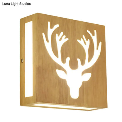 Warm-toned bamboo wall light with deer antler cutout silhouette glowing softly direct wired electric maximum bulb wattage