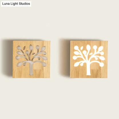 Two square wooden wall sconces with tree silhouette cut-out design for modern square flush mount corridor lighting