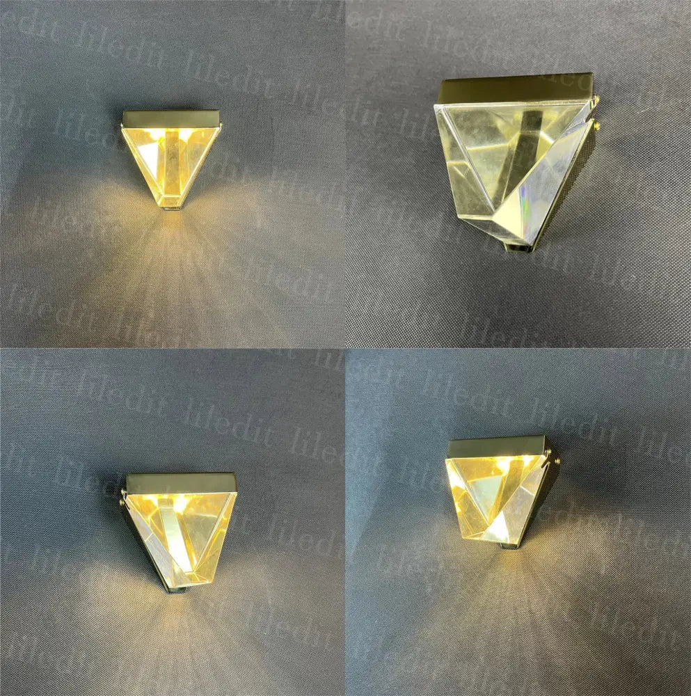 Modern triangular bronze crystal wall sconce with gold trim and faceted prism refracting light for living room decorbites crystal wall