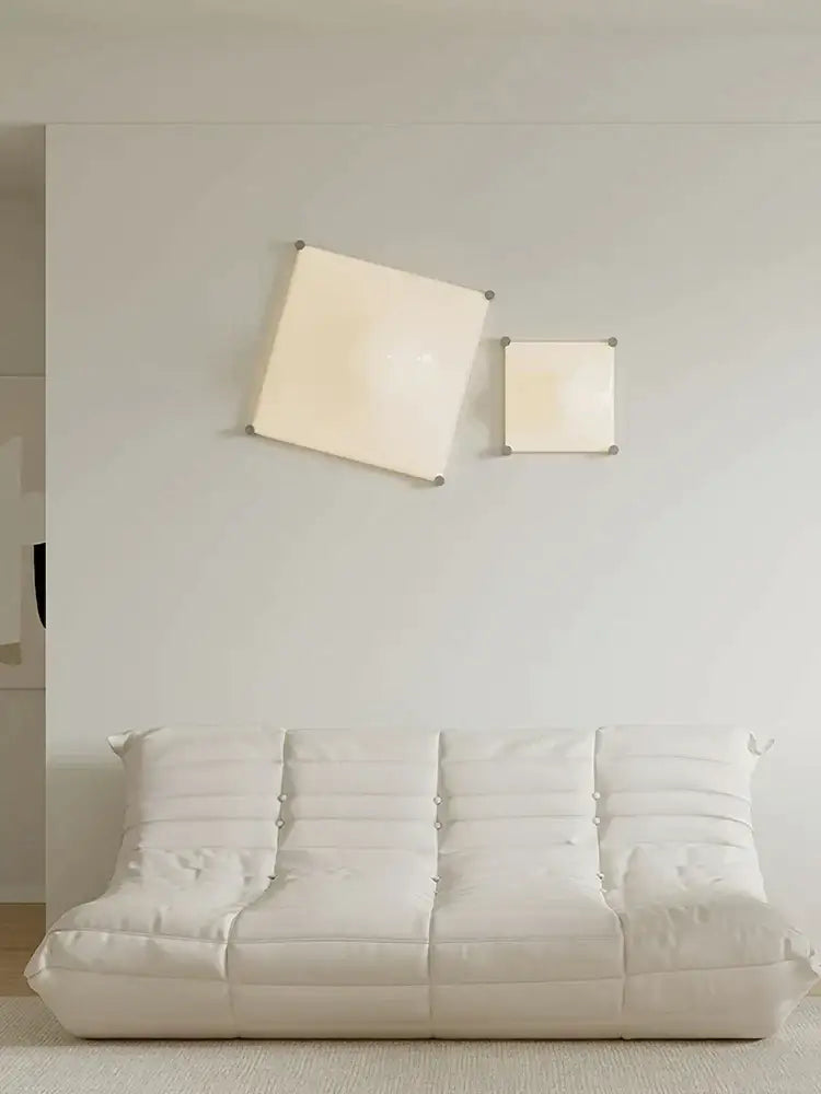 Modern triangular cream style wall lamp with frosted glass sconce complements cream style wall and decorbites cream style decor