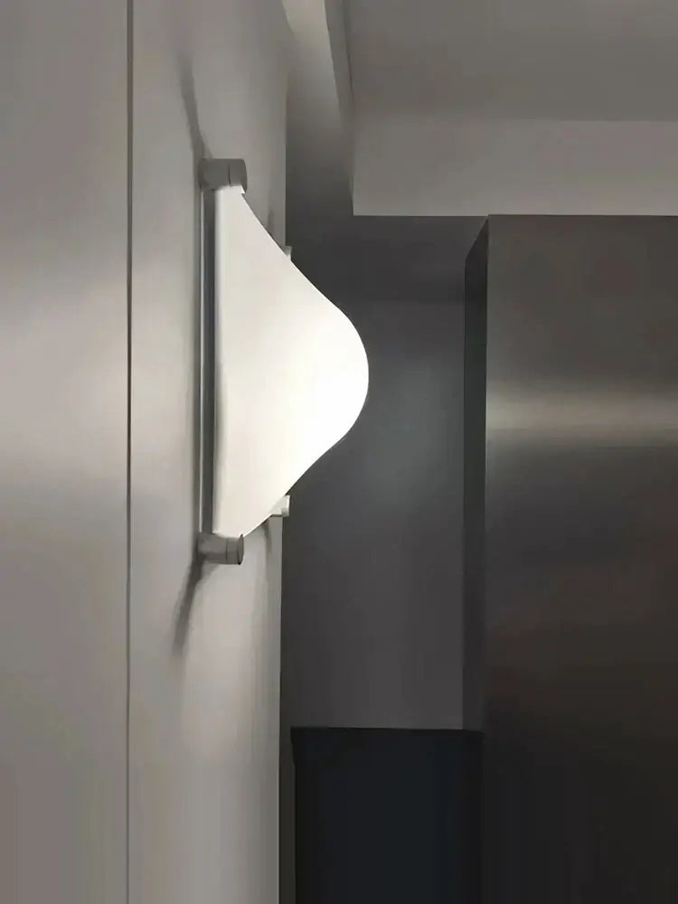 Modern triangular cream style wall lamp with frosted glass shade and metallic silver frame for bedroom decorbites cream style