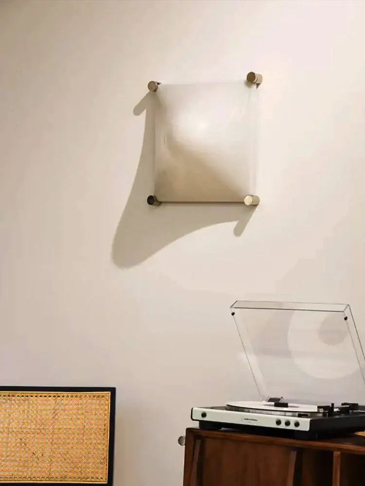 Modern triangular cream style wall lamp with frosted glass diffuser and brushed brass fixtures for bedroom decorbites cream style