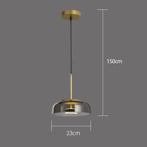 Modern tricolor glass pendant light with brass finish, smoked glass dome, and black cord for dining room use