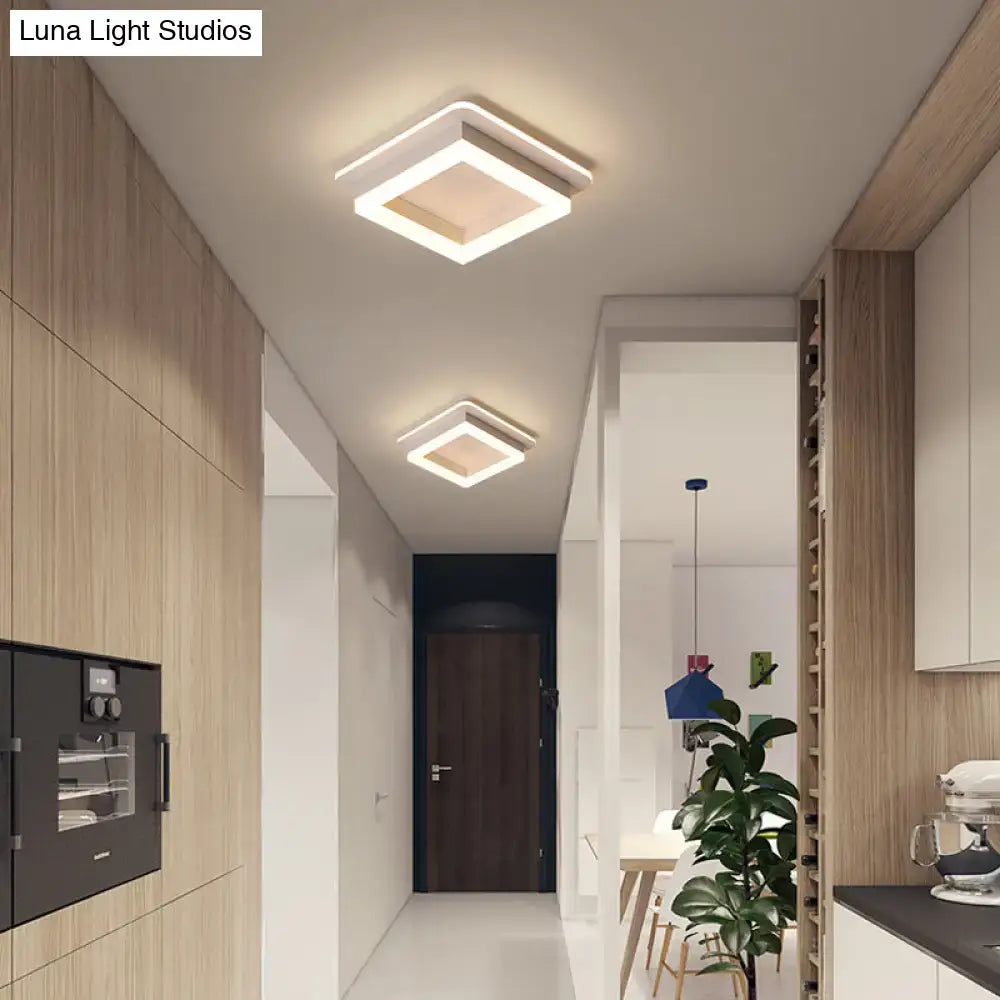 Modern square decorbites led flush mount ceiling light with white metal frame and warm acrylic diffuser illumination
