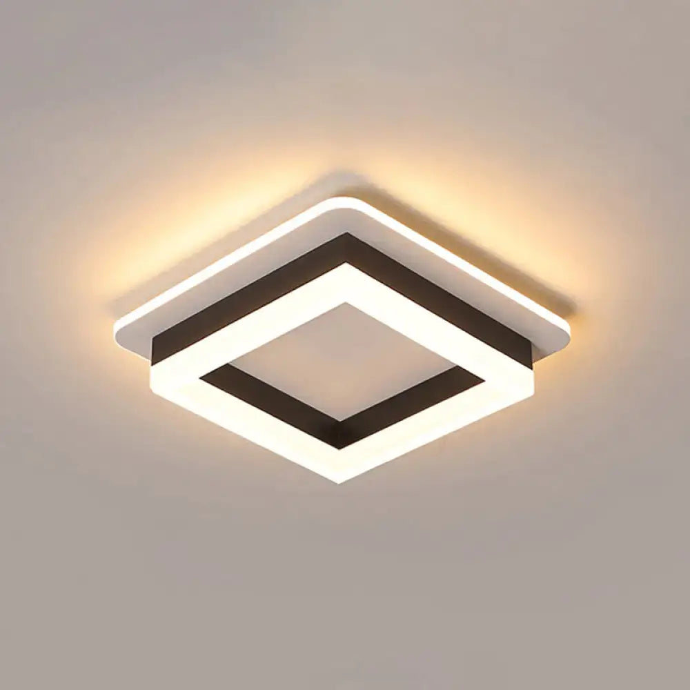 Modern white and black metal led flush mount ceiling light with acrylic diffuser and illuminated geometric edges by DecorBites™