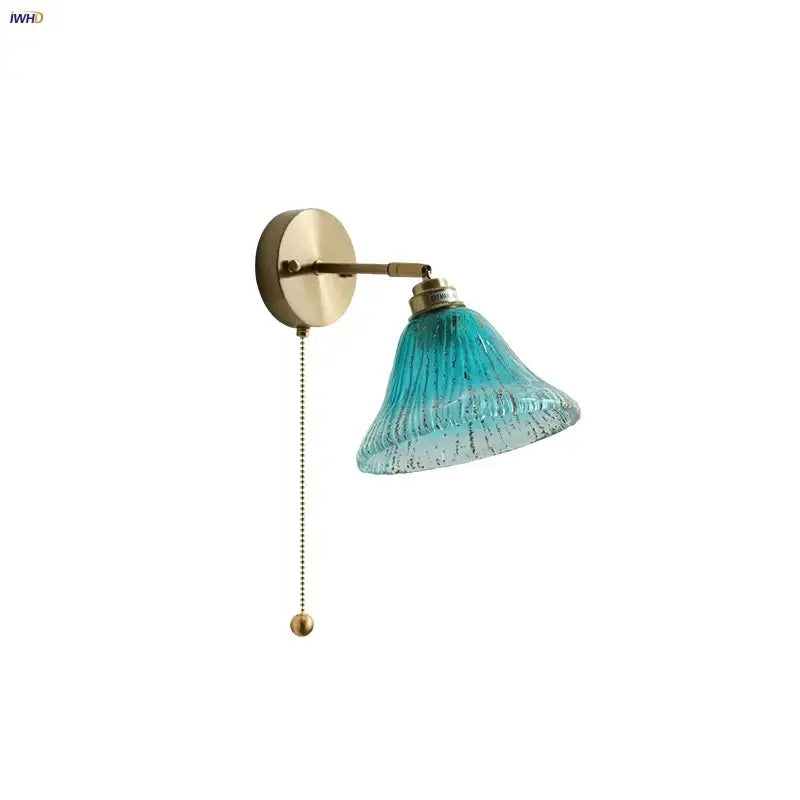 Modern turquoise blue glass wall sconce with textured decorbites blue glass lampshade and brass pull chain fixture