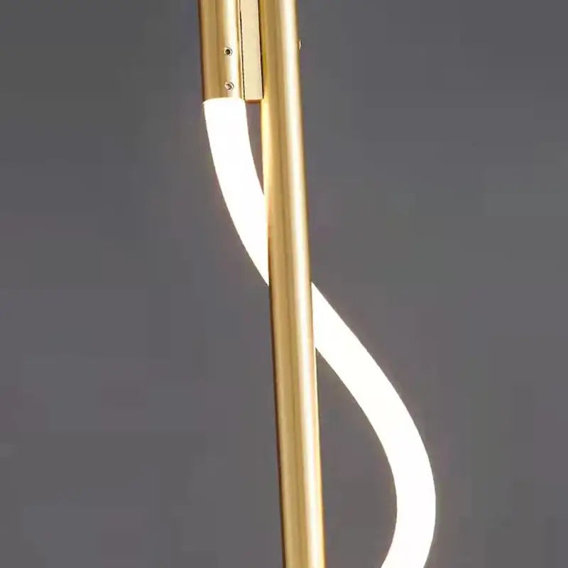 Gold-finished modern floor lamp with sleek curved led light strip forming elegant s-shape for dimming wall lights decorbites