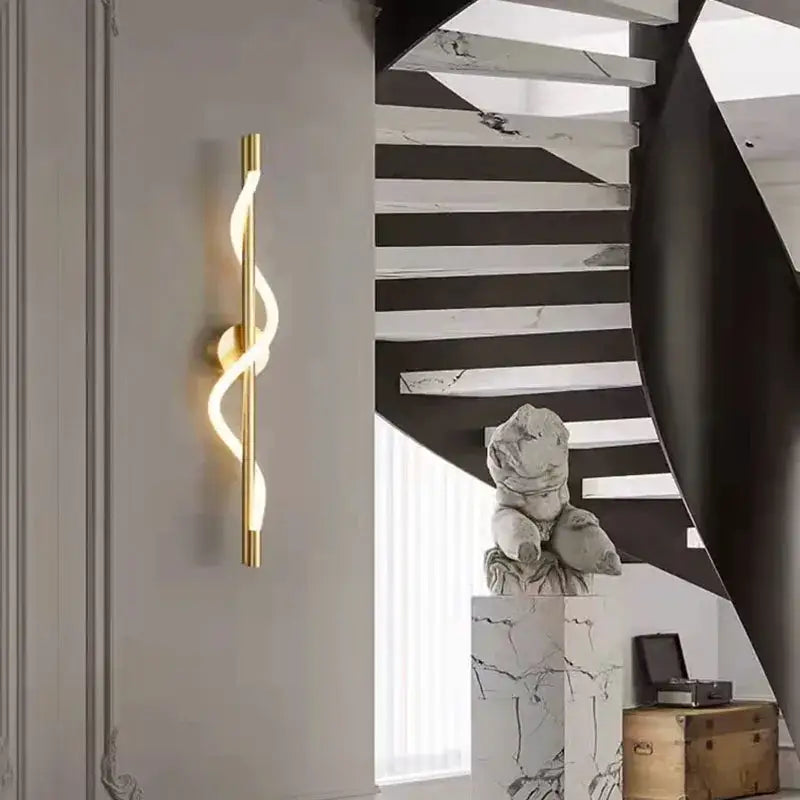 Gold-colored sleek curved wall lights with modern spiral design for decorbites dimming wall bedroom led sconce