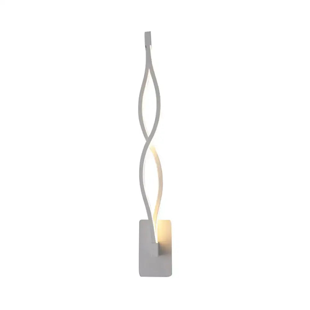 Modern twisted black and white led wall sconce with a sleek silver design and warm ambient led wall lighting for bedrooms