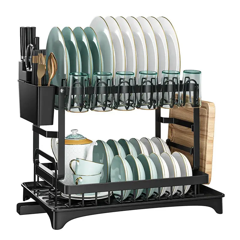 Modern two tier black metal dish drainer rack with integrated utensil holder and glass cup holders holding kitchenware