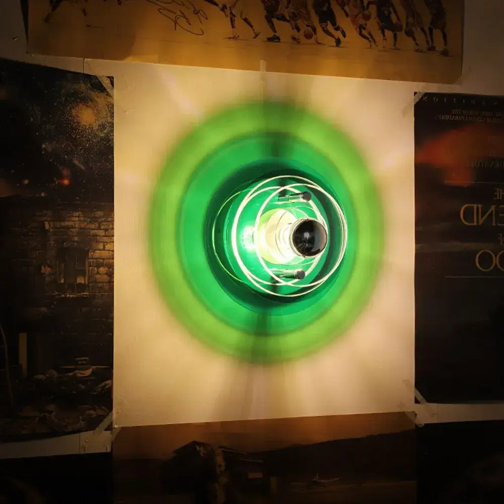 Modern ufo acrylic led wall lamp glowing green with concentric rings and central bulb for living room decorbites led wall lamp