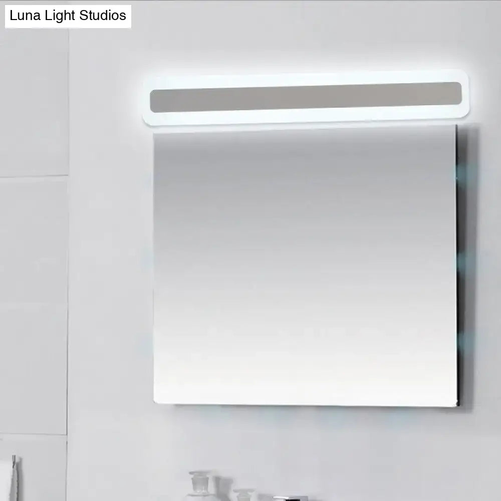 Modern rectangular bathroom mirror with sleek white frame and integrated led light strip paired with ultrathin bar shaped wall sconce