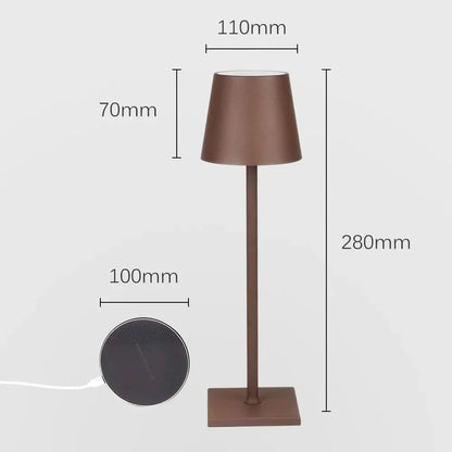 A sleek modern usb rechargeable acrylic table lamp with matte bronze finish and tapered shade for bedroom use