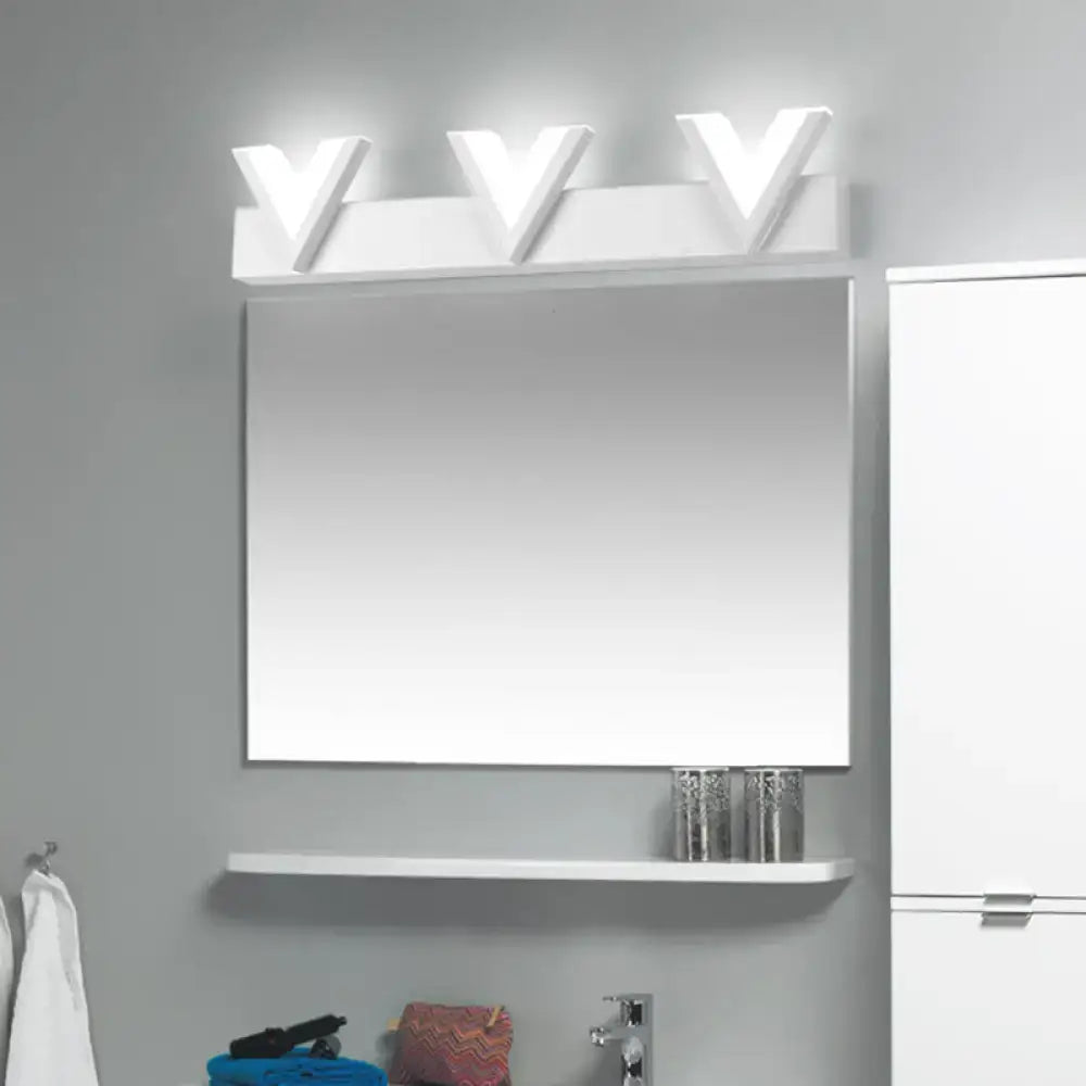 Modern white rectangular bathroom mirror with warm white v-shaped led vanity light and matching shelf below