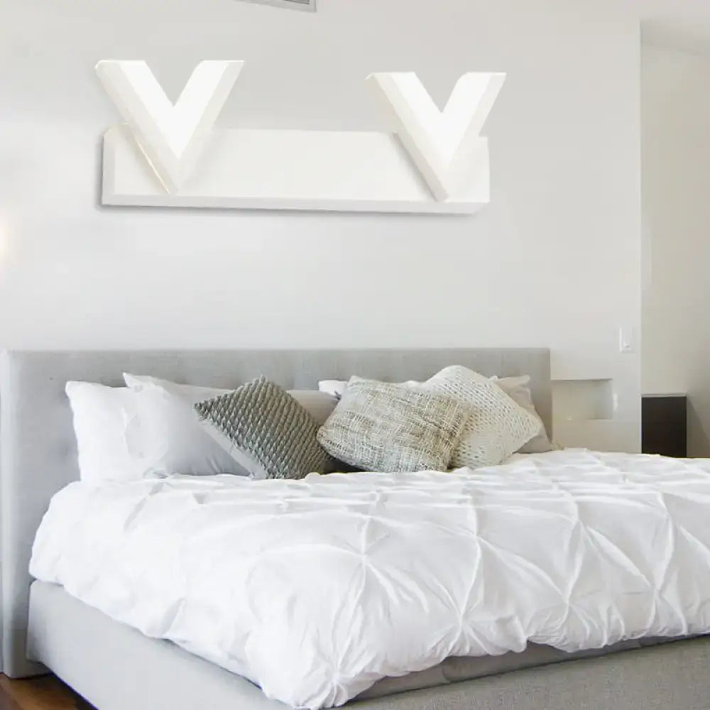 Modern v-shaped white led vanity light with warm white illumination for bathroom mirror mounted on wall