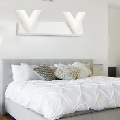Modern v-shaped white led vanity light with warm white illumination for bathroom mirror mounted on wall