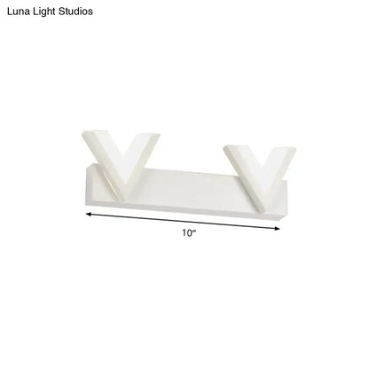 Modern v-shaped white led vanity light with sleek design emitting warm white light for bathroom mirror use