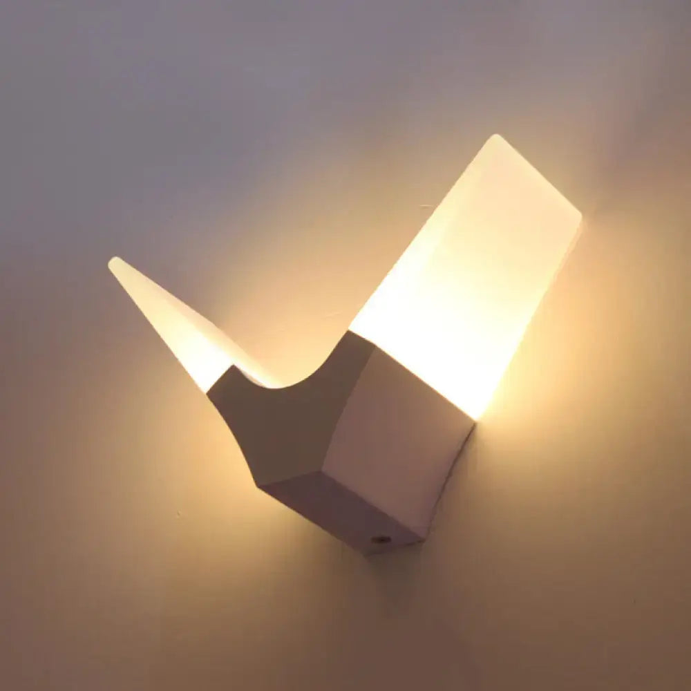 Modern v-shaped white sconce light with warm white glow and minimalist geometric design for bedroom wall lighting