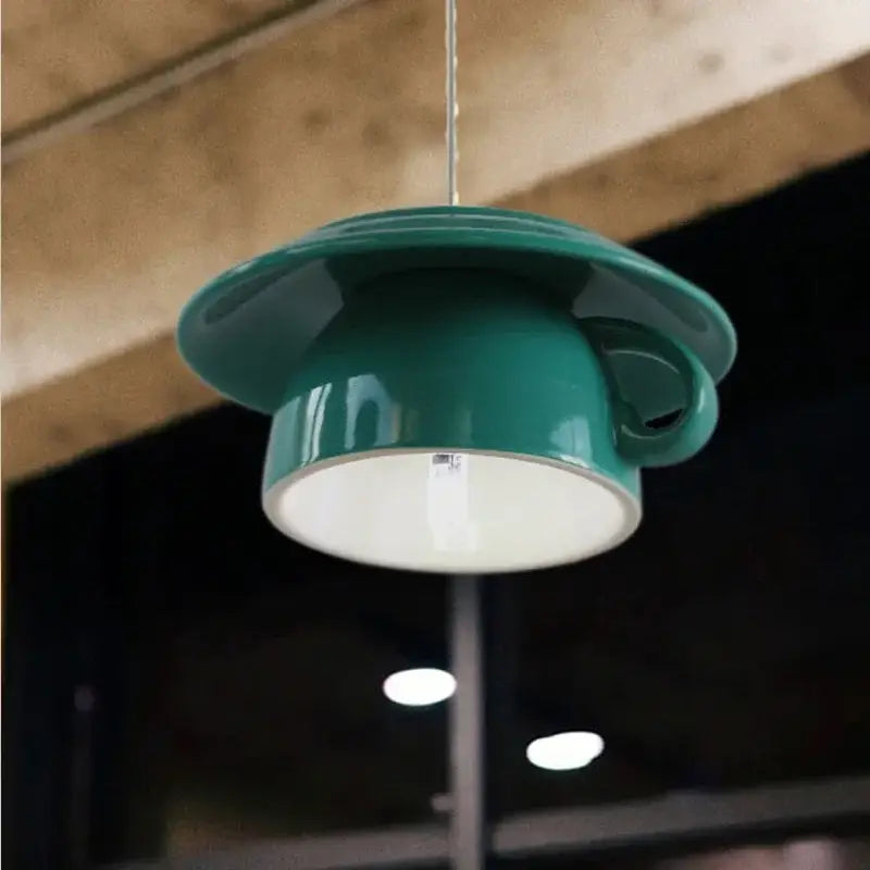 Teal ceramic cup pendant light with white interior and handle suspended by wire modern vibrant decorbites ceramic cup