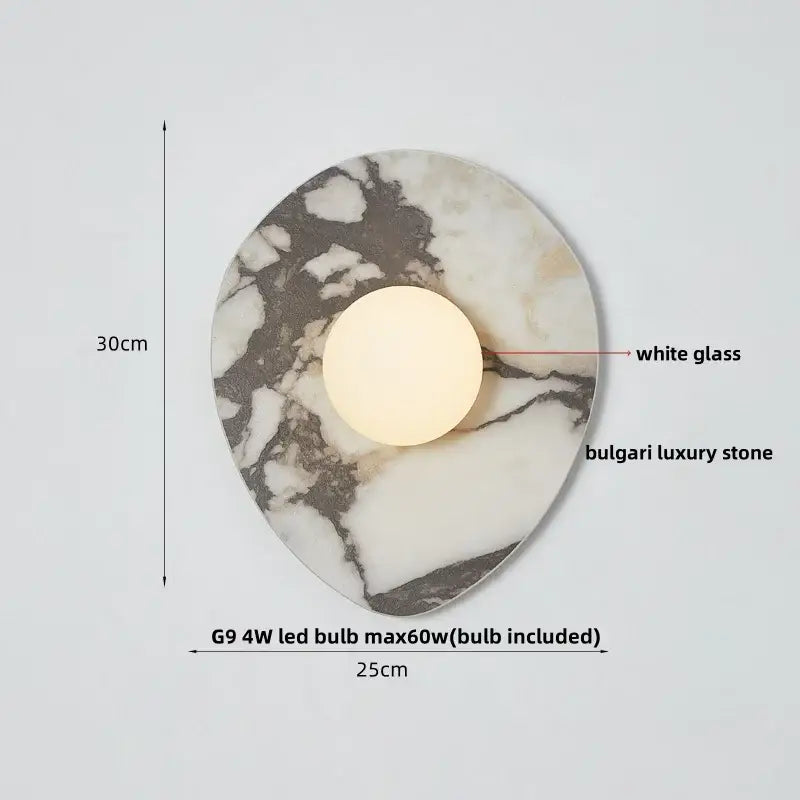 Modern wabi sabi black and cream resin led wall lamp with a white glass bulb and polished luxury stone base