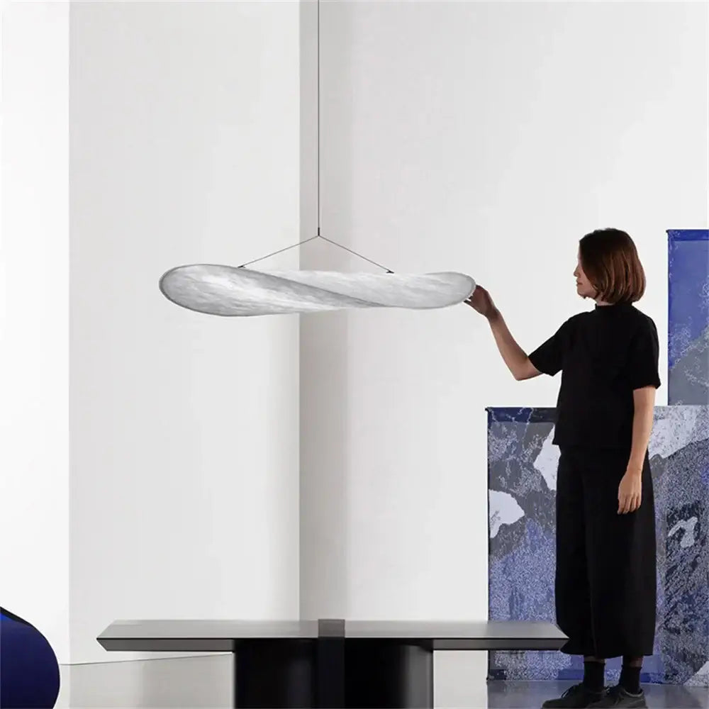 A sleek silver twisted pendant light with smooth flowing design for bedroom decorbites japanese style chandelier
