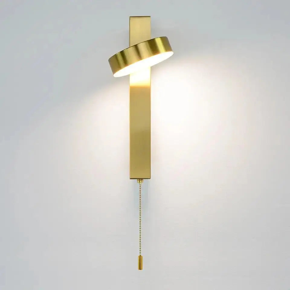 Gold-finished modern wall sconce with sleek rectangular body and angled circular light for 350° adjustable wall sconces