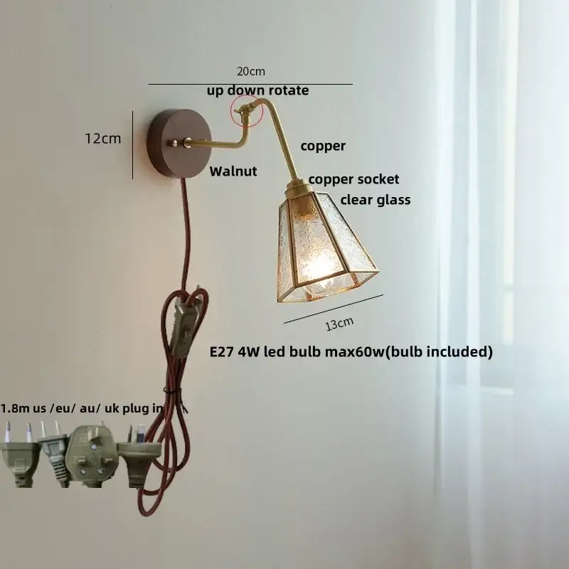 Modern walnut and brass clear glass led wall sconce with copper adjustable arm and walnut-finished mounting plate