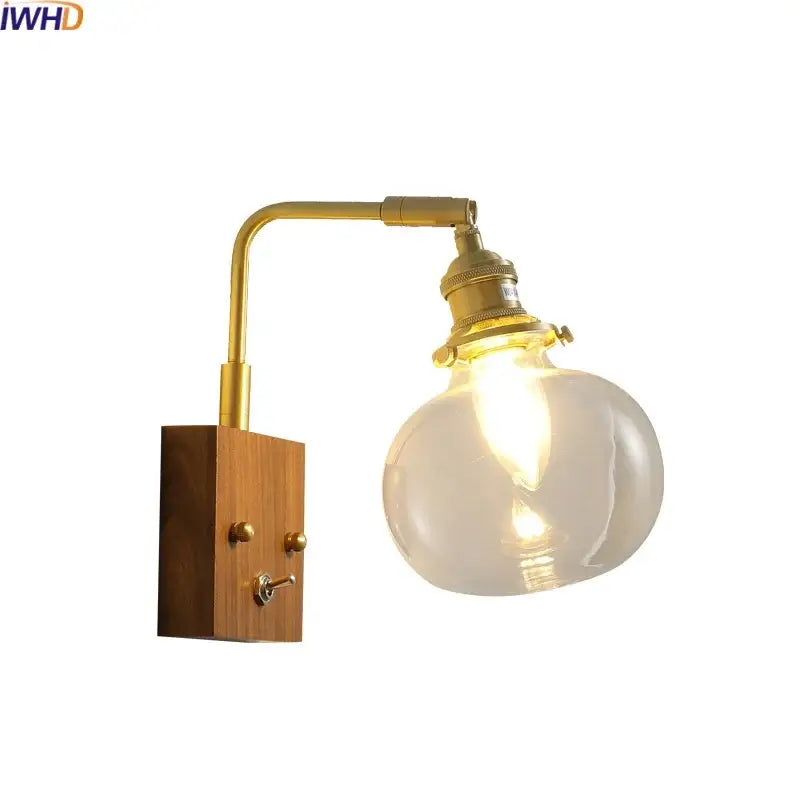 Modern walnut copper wall sconce with brass finish wooden base and clear glass bulb for stair lighting