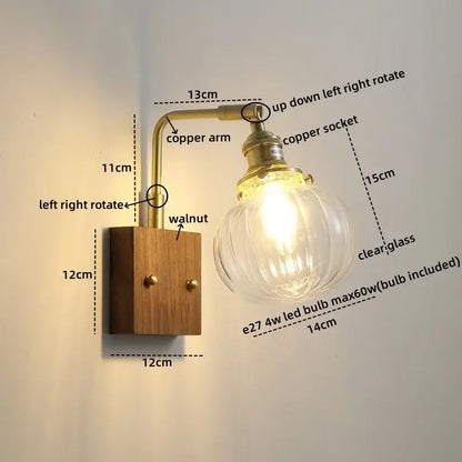 Modern walnut copper wall sconce with clear glass bulb brass finish and walnut wood base for stair lighting